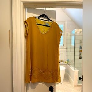 Shimmery, beaded gold dress.